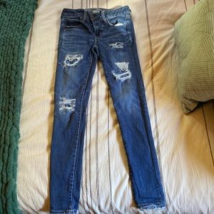 Ripped patched jeans